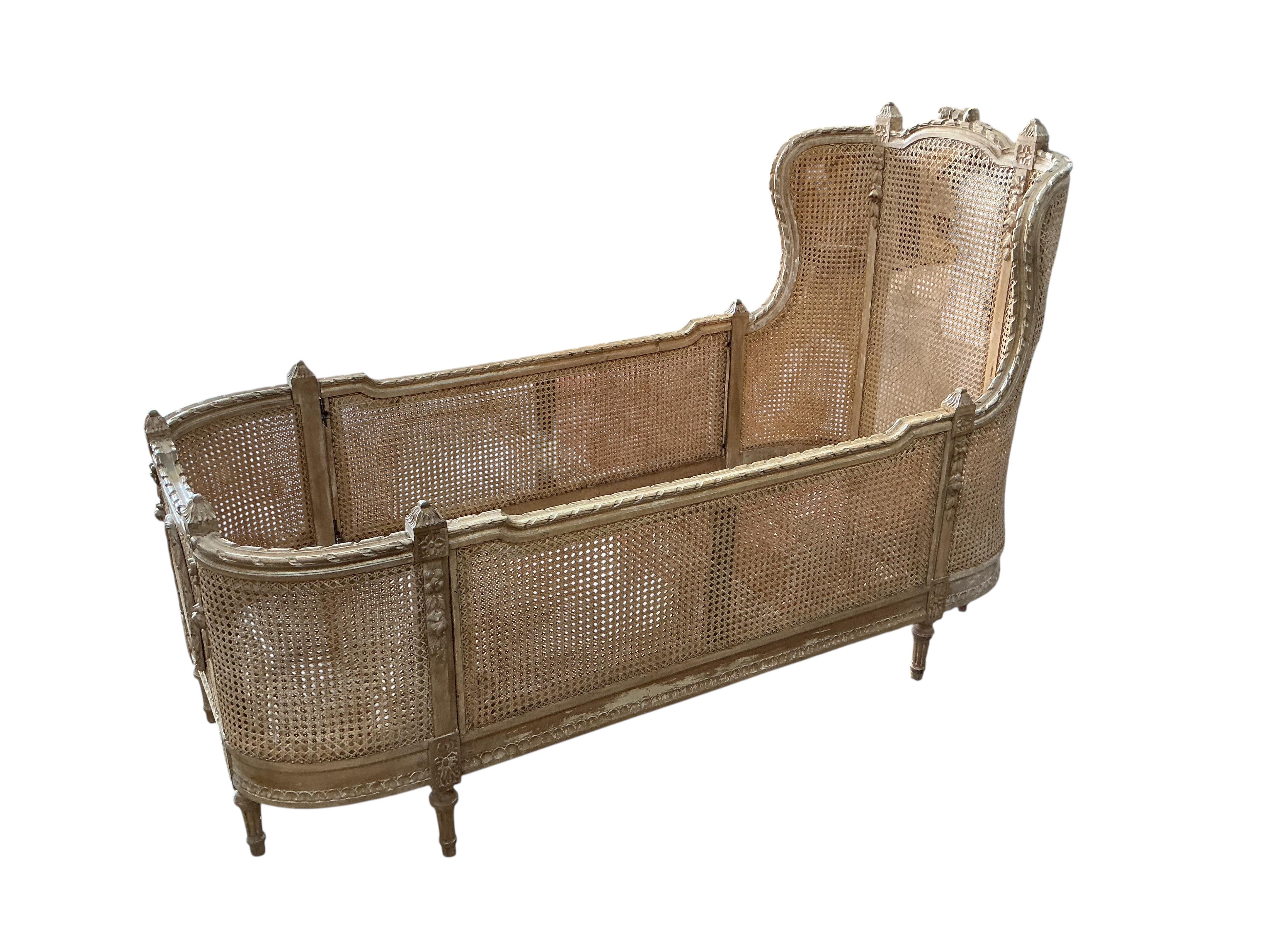 A Louis XVI style caned beech child's bed frame, width 71cm, height 105cm